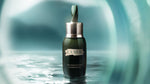 Wide view of Crème de La Mer Moisturizing Cream, White jar placed on a serene water surface, reflecting its deeply hydrating and soothing qualities for ultimate skin renewal.