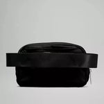 Back view of the Lululemon Everywhere Belt Bag 1L in Black, displaying the adjustable strap and durable fabric, designed for comfort and longevity.