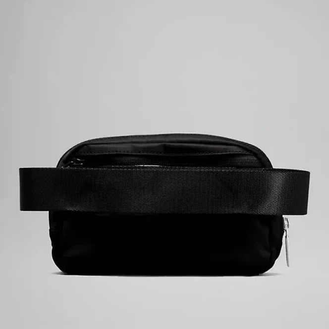 Back view of the Lululemon Everywhere Belt Bag 1L in Black, displaying the adjustable strap and durable fabric, designed for comfort and longevity.