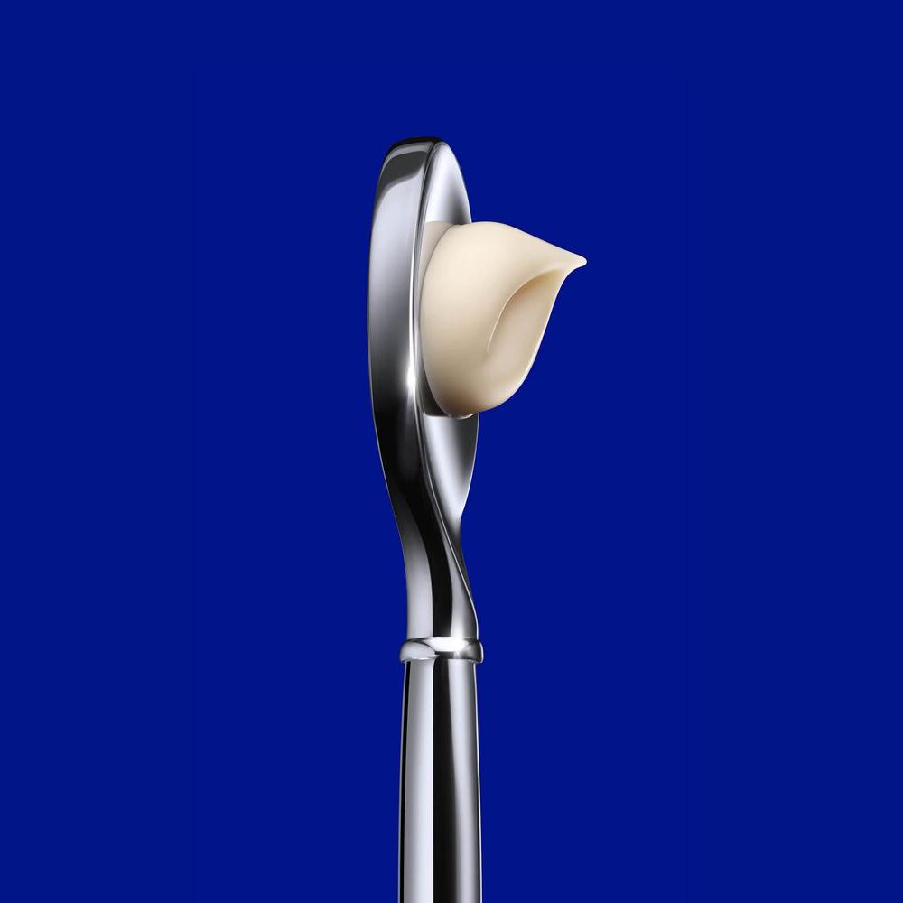 Close-up of La Prairie Skin Caviar Luxe Cream with its elegant applicator. This premium anti-aging cream is infused with caviar extract and micro-nutrients to rejuvenate and firm the skin, offering a luxurious skincare experience