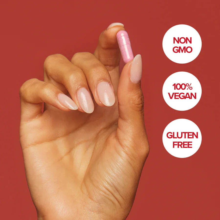 A close-up of a woman holding a URO Vaginal Probiotic capsule, emphasizing science-backed ingredients for maintaining healthy vaginal pH and balancing vaginal flora.
