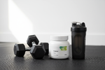 Thorne Creatine gym lifestyle with dumbbells