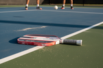 JOOLA Perseus V Pro paddle on outdoor pickleball court