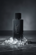 YSL MYSLF bottle on dark marble with ice crystals